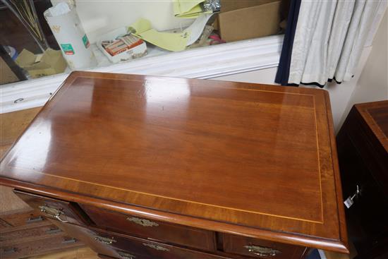 A George III walnut chest of drawers, on bun feet W.101cm